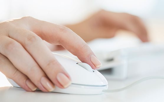 Hand moving a computer mouse